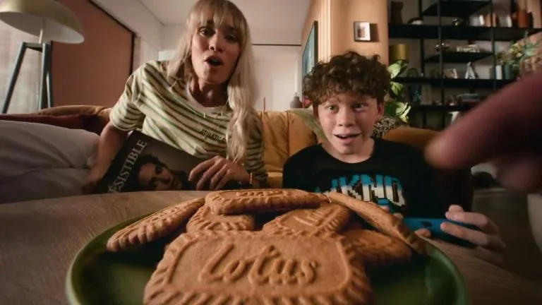 Friends gathered around a table sharing biscuits